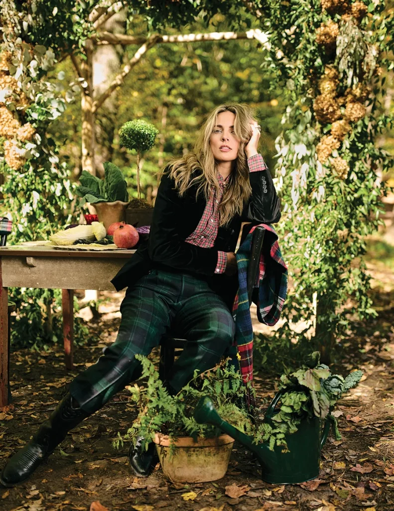 Model in front of a green arch