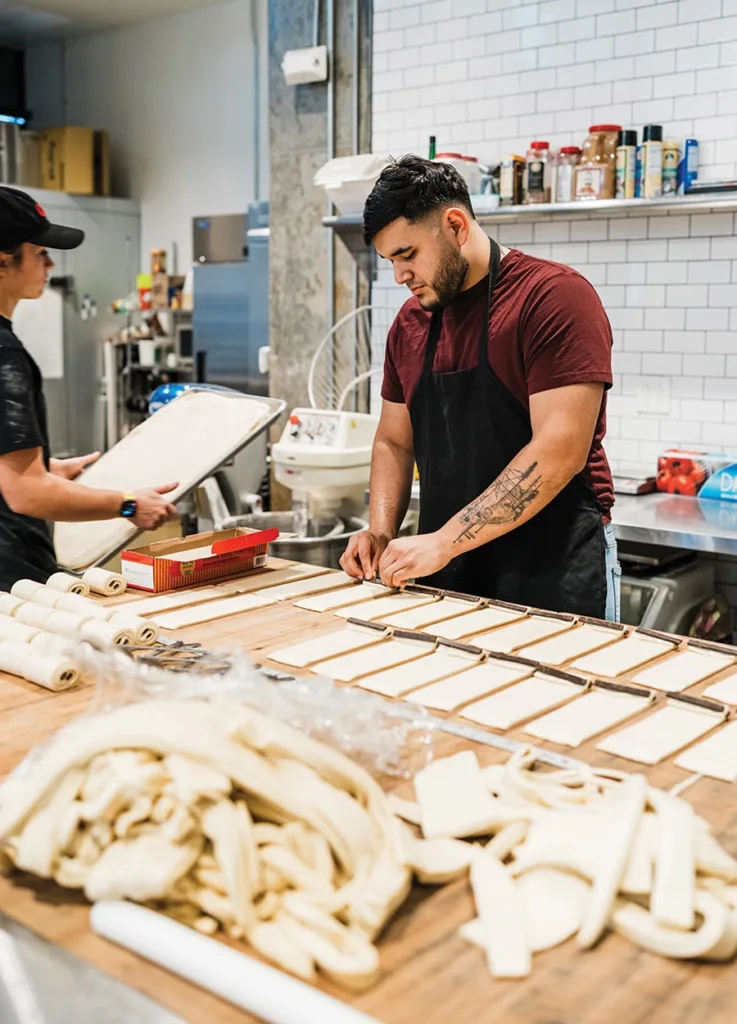 Vicente worker making pastries