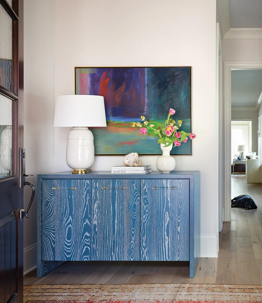 Blue foyer cabinet by Aronson Woodworks.