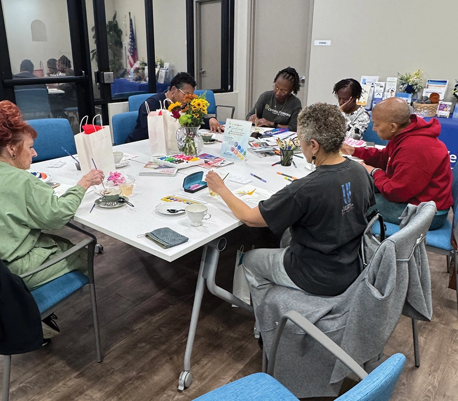 Caregivers enjoy a Mindful Paint & Sip tea in August.