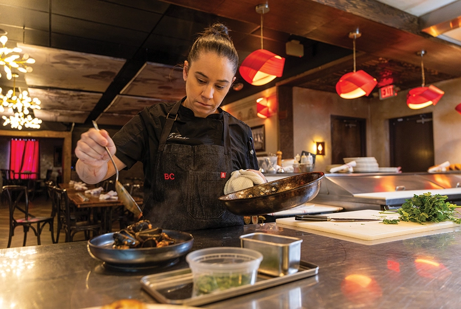 Chef Brittany Cochran plating food
